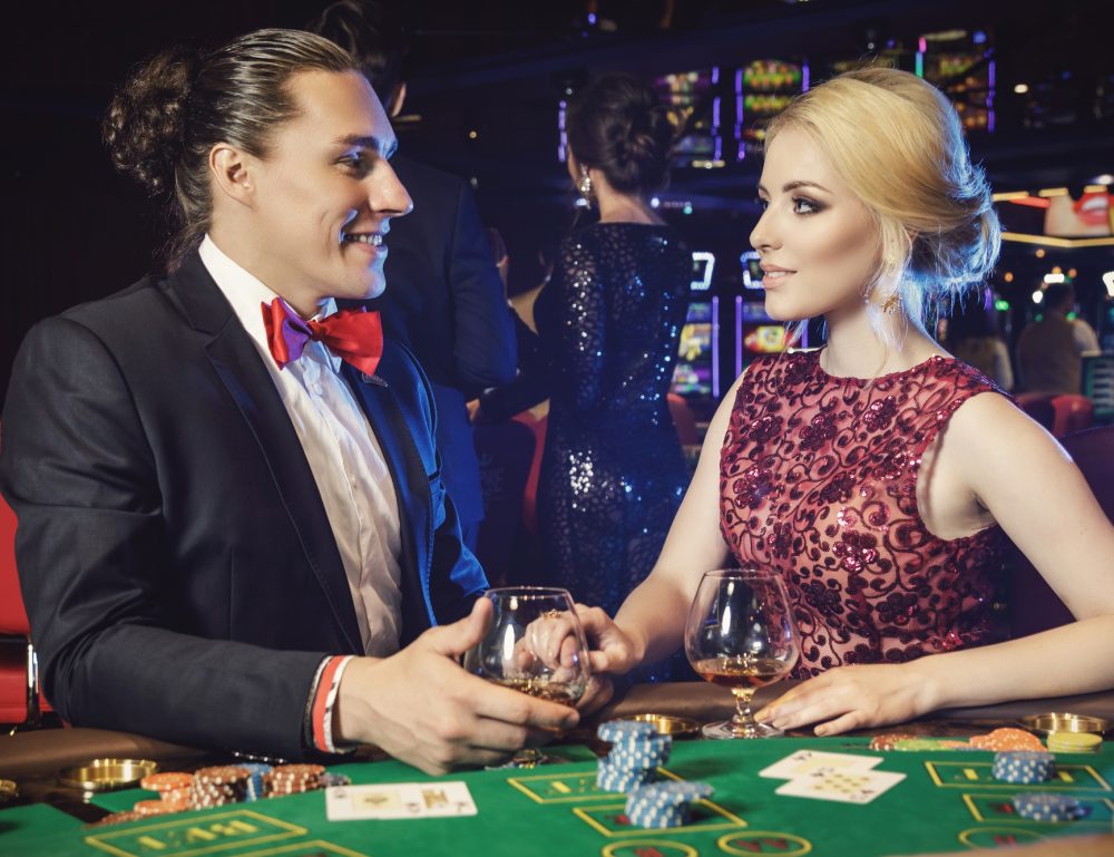 Young and beautiful couple in the casino Young and beautiful couple in the casino